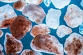 Collection of minerals on blue background, himalayan salt rocks
