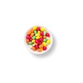 Close up photo of colorful candy pills in a bowl. Top view of isolated candies with copy space Royalty Free Stock Photo