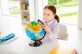 Close up photo of concentrated focused girl clever find country map sphere look dressed white shirt blouse fashionable