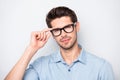 Close up photo of confident serious intelligent clever smart man staring at you intently with new eyewear isolated over