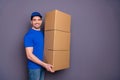 Close up photo cool specialist he him his delivery boy hold strong arms large big parcel boxes accept recipient changing Royalty Free Stock Photo