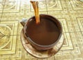 close up photo a cup of traditional coffee with palm sugar and cinnamons