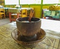 close up photo a cup of traditional coffee with palm sugar and cinnamons