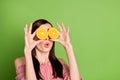 Close up photo of cute pretty playful student girl hold two oranges spectacles shocked imagine watching movie wear