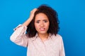 Close up photo of cute young woman curly hair touch head confused make mistake dressed trendy print look isolated on Royalty Free Stock Photo