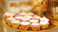 Delicious golden sweet table with cupcakes