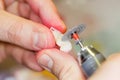 Dental technician working on a tooth crown