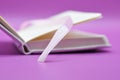 close up photo - diary on purple background Royalty Free Stock Photo