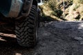 Dirty wheel of a jeep in a rural path