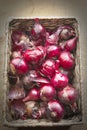 Fresh red onions piled in a basket Royalty Free Stock Photo