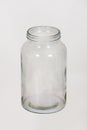 Close up photo of an empty jar, open lid, isolated over white background with copy space. Glass bottle package for canning and Royalty Free Stock Photo