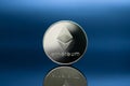 Close-up photo of ethereum silver coin ETH on black background