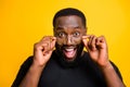 Close up photo of excited funny black man wearing eye glasses for the first time seeing his friends dictinctly isolated Royalty Free Stock Photo