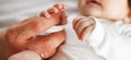 Close up photo of father holding newborn baby hand. Royalty Free Stock Photo