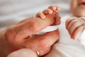 Close up photo of father holding newborn baby hand. Royalty Free Stock Photo
