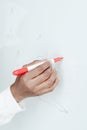 Close up photo. Female african american hand holds a felt-tip pen and writes them on a white board Royalty Free Stock Photo