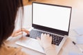 Close up photo of female hands and laptop with blank monitor. Mockup of computer screen. Copy Space ready for design or text Royalty Free Stock Photo