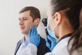 close up photo of a female otolaryngologist examining the ear Royalty Free Stock Photo