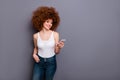 Close up photo of foxy lady telephone reader instagram post followers wear white tank-top jeans denim grey