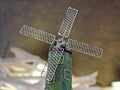 Close-up photo of a fragment of a decorative figure in the form of a windmill