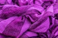 Close-up photo of a fragment of folds of fabric of purple color. Royalty Free Stock Photo