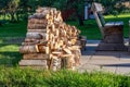 Close up photo of fresh stacked fire wood logs on barbeque spot, garden. A lot of birch logs harvested to be used for grilling.