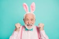 Close up photo of funky excited positive retired gentleman celebrate traditional easter event raise fists enjoy victory
