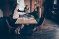 Close up photo glad business people he him his she her partners marketing sit table office together arms gathered