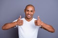 Close up photo glad healthy teeth dark skin he him his macho bald head sure approve show thumbs fingers up advise buy Royalty Free Stock Photo