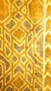 Close up photo of gold geometric carpet pattern Royalty Free Stock Photo