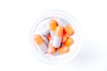 Close-up photo of Gray orange pills isolated on white background Royalty Free Stock Photo