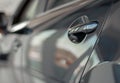 Close up photo of grey car door handle in autoshow Royalty Free Stock Photo