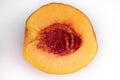 Close-up top view of one half of a cutted yellow juicy peach Royalty Free Stock Photo