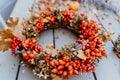 Close up photo of handmade colorful floral autumn door wreath Royalty Free Stock Photo