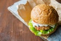 Close-up photo of home made hamburger with beef, onion, tomato, lettuce, cheese and spices. Fresh burger closeup on Royalty Free Stock Photo