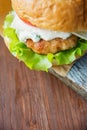 Close-up photo of home made hamburger with beef, onion, tomato, lettuce, cheese and spices. Fresh burger closeup on Royalty Free Stock Photo