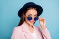 Close up photo of interested woman touch her retro vintage specs look want flirt handsome guy wear pink topcoat isolated Royalty Free Stock Photo