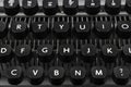 Close-up photo of keyboard and keys with letters of an old and vintage typewriter, side view Royalty Free Stock Photo