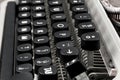 Close-up photo of keyboard and keys with letters of an old and vintage typewriter, side view, selective focus Royalty Free Stock Photo