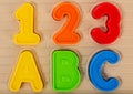 Close up photo of kids toy multi colored numbers and letters Royalty Free Stock Photo