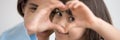 Little daughter and mother join fingers forming heart shape closeup Royalty Free Stock Photo