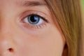 Close-up photo of little girl`s blue eyes