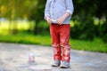 Close-up photo of little kid boy drawing with colored chalk on asphalt Royalty Free Stock Photo