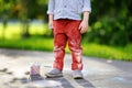 Close-up photo of little kid boy drawing with colored chalk on asphalt Royalty Free Stock Photo