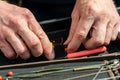 Close up photo of male hands with fishing gear