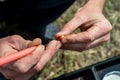 Close up photo of male hands with fishing gear