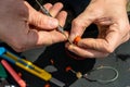 Close up photo of male hands with fishing gear