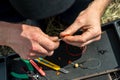 Close up photo of male hands with fishing gear