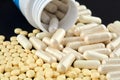 Close-up photo of many white and yellow pills Royalty Free Stock Photo