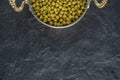 Close up photo of marinated green olives over black background Royalty Free Stock Photo